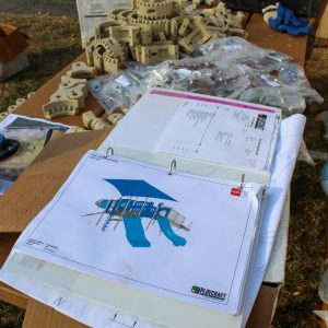 a book of construction plans and various hardware